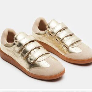 Steve Madden momentum gold sneaker